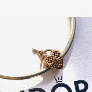 Gold heart key charm